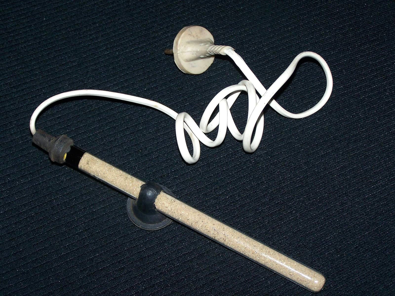 A submersible aquarium heater — the equipment category that keeps a betta tank in the 78–82 °F target range.