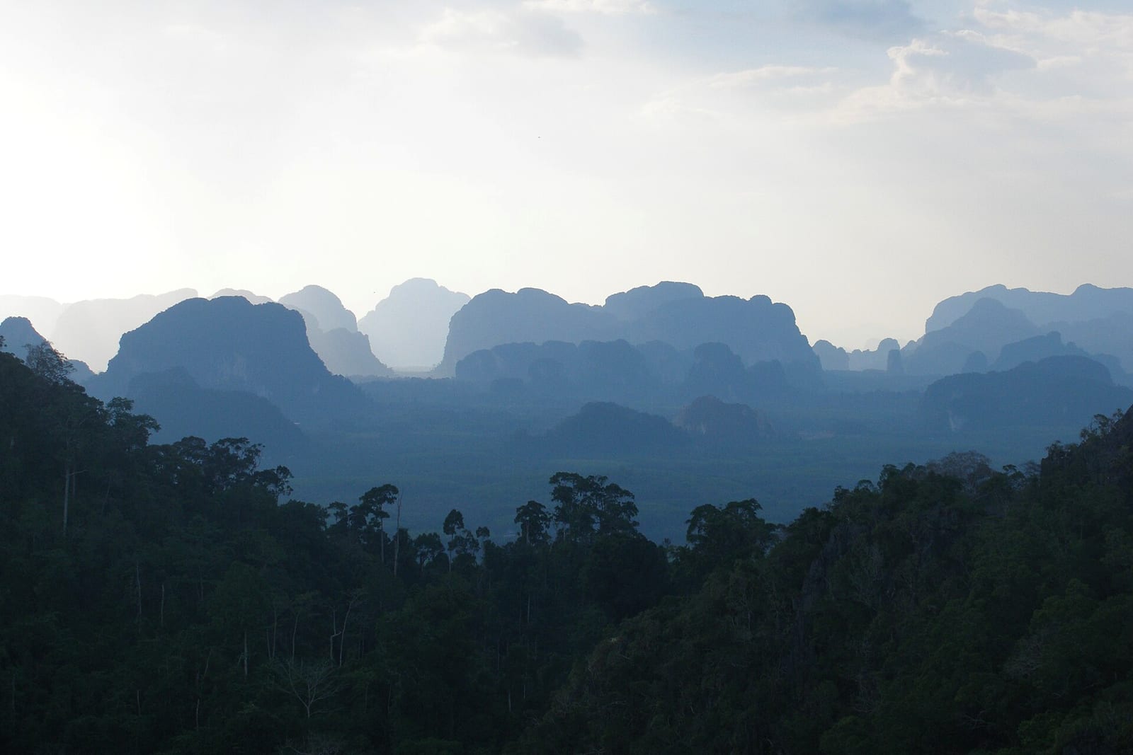 Tower karst landscape in Krabi Province, southern Thailand - isolated and clustered limestone peaks rising over the plain.